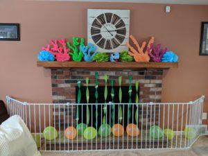 The fireplace decorations for Little Man's baby shark party!