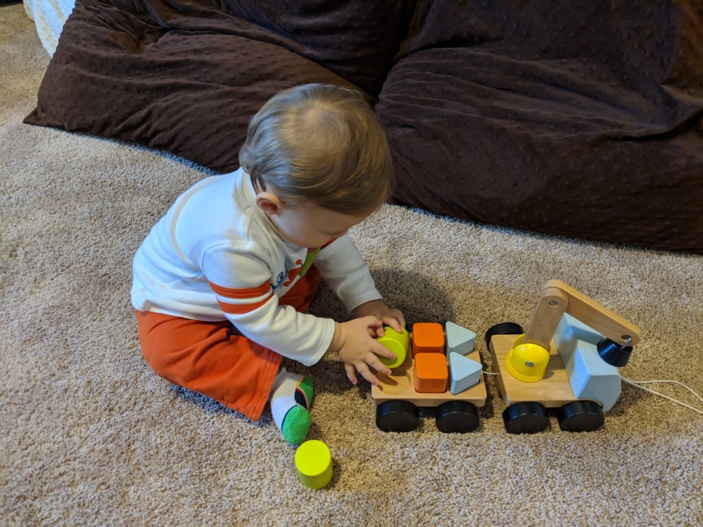 This construction themed activity shows Little Man playing with a puzzle crane from IKEA.