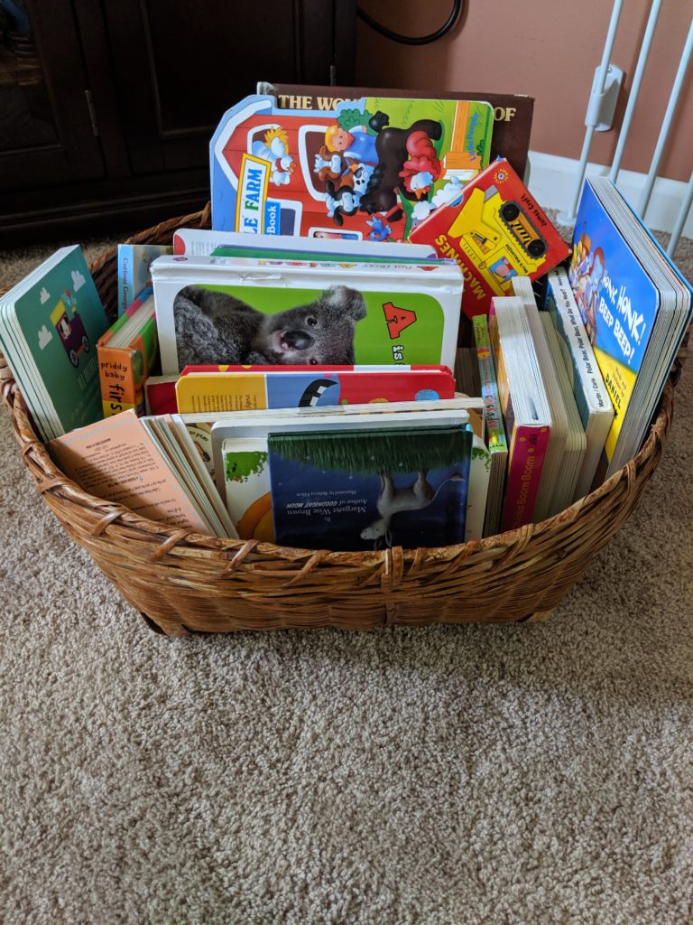 A basket of books that are always available during my toy rotation system.