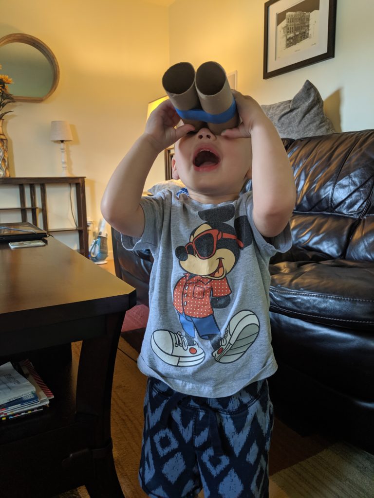 Little Man looking through his binoculars