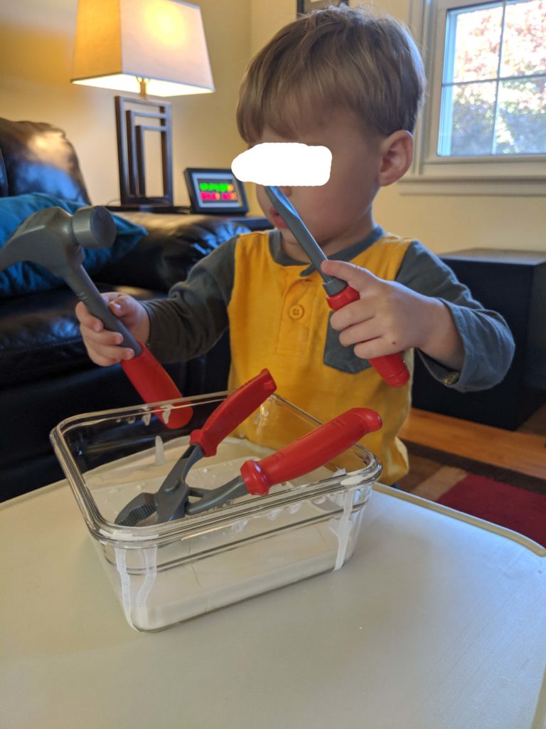 Little Man using his tools