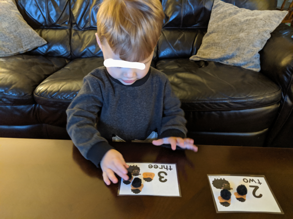 Little Man counting the wool for Baa Baa Black sheep!