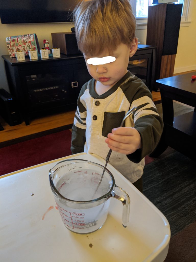 Little Man mixing the Borax solution. We were very careful!